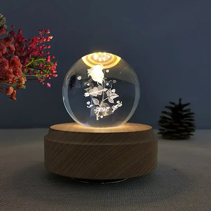 Clear glass crystal ball music box with engraved white rose and warm yellow light for bedroom decor rotating wooden base