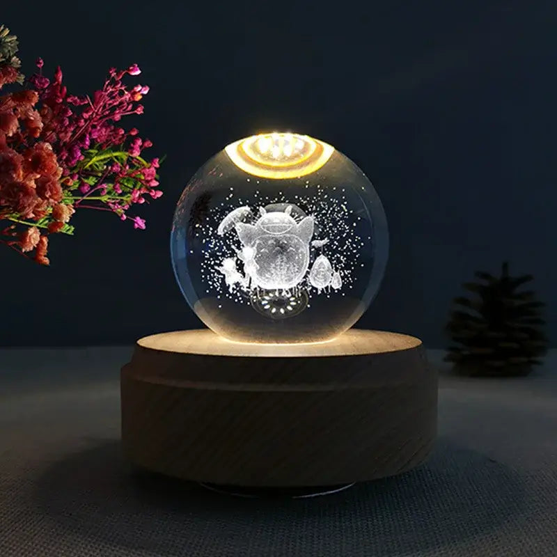 Galaxy crystal ball music box featuring a glowing transparent lamp with etched teapot design on wooden base