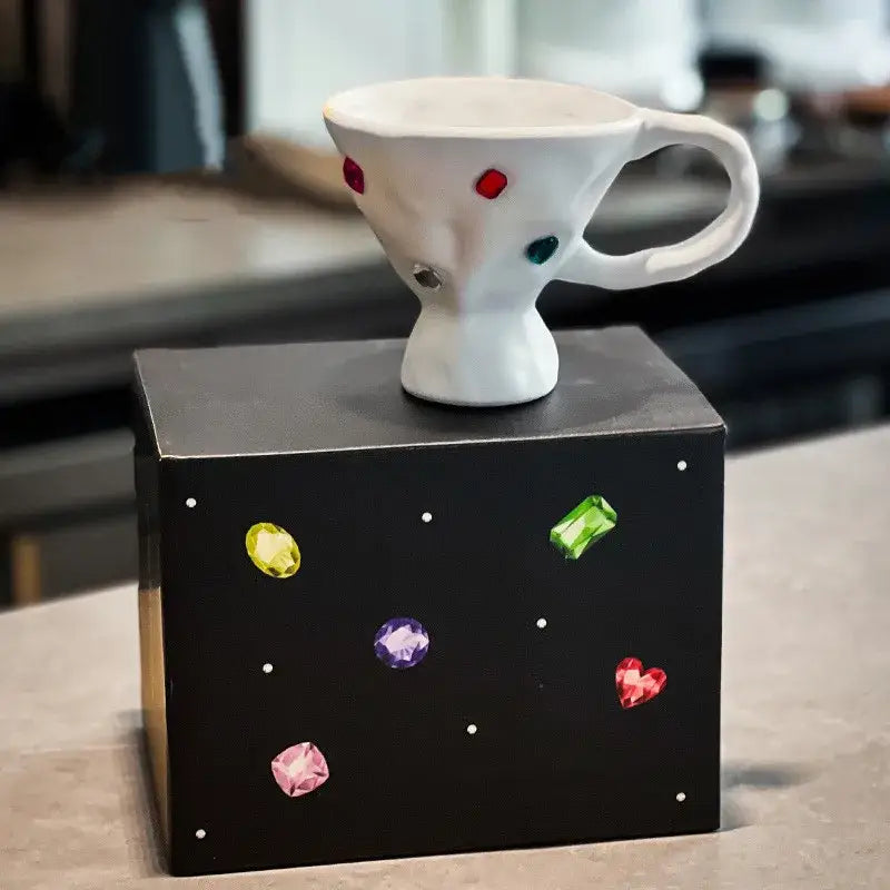 White ceramic gemstone setting ceramic coffee filter mug with colorful red green blue and purple dots decorbites design