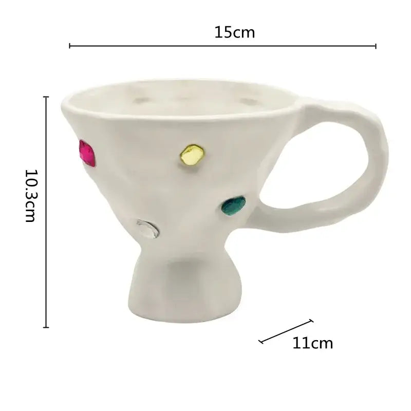 White ceramic gemstone setting ceramic breakfast mug with textured surface and colorful pink yellow green accents decorbites