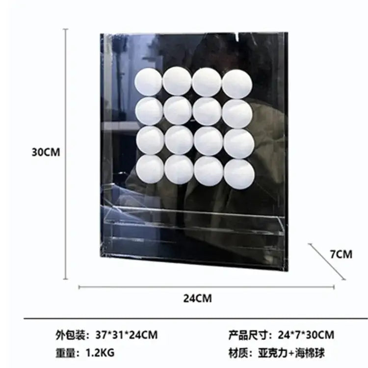 A geometric abstract acrylic ball ornament display box with white acrylic ball sponges neatly arranged inside