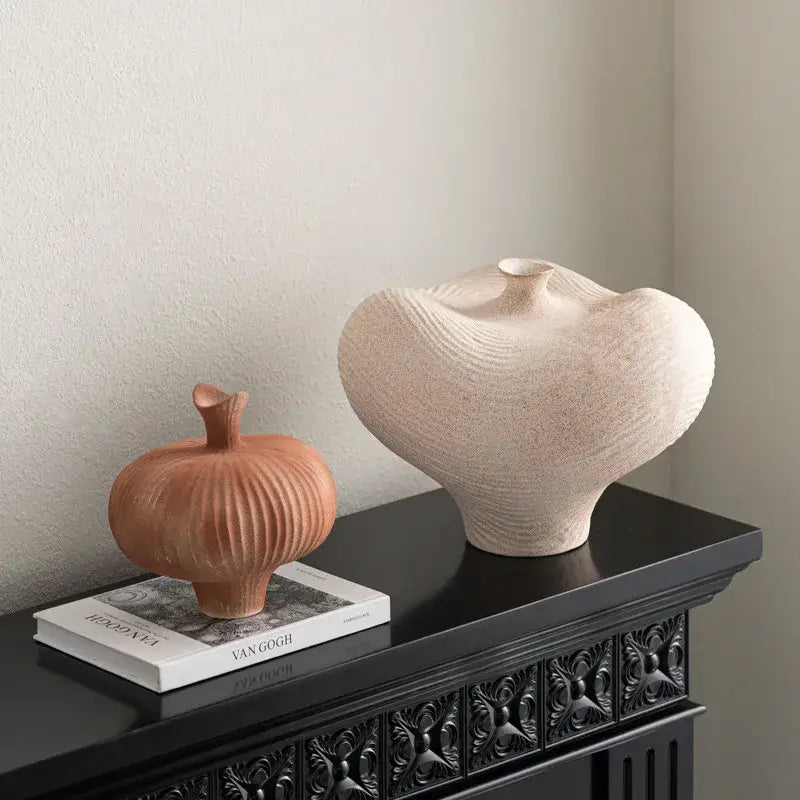 Cream-colored geometric abstract ceramic vase with textured wavy surface and narrow neck for living room decorbites decor