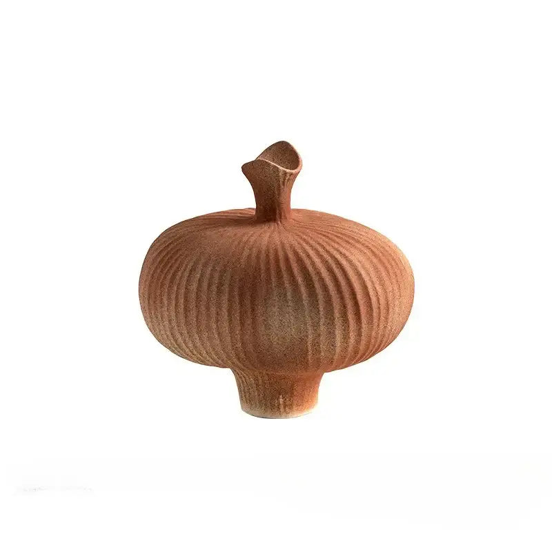 A terracotta-colored geometric abstract ceramic vase with vertical ridges and flared opening for living room decorbites decor