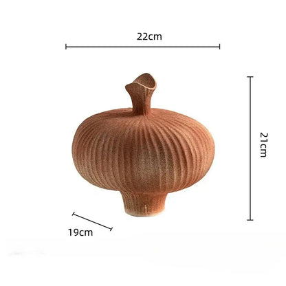Terracotta-colored geometric abstract ceramic vase with vertical ridges and small flared neck for living room decorbites decor
