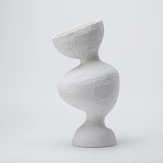 White ceramic geometric abstract vase with textured sculptural design for modern living room decor by decorbites geometric abstract