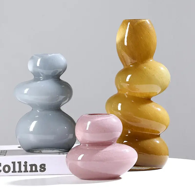 Three stacked stackable terrarium glass vases in gray pink and amber hues for home decor by decorbites geometric glass