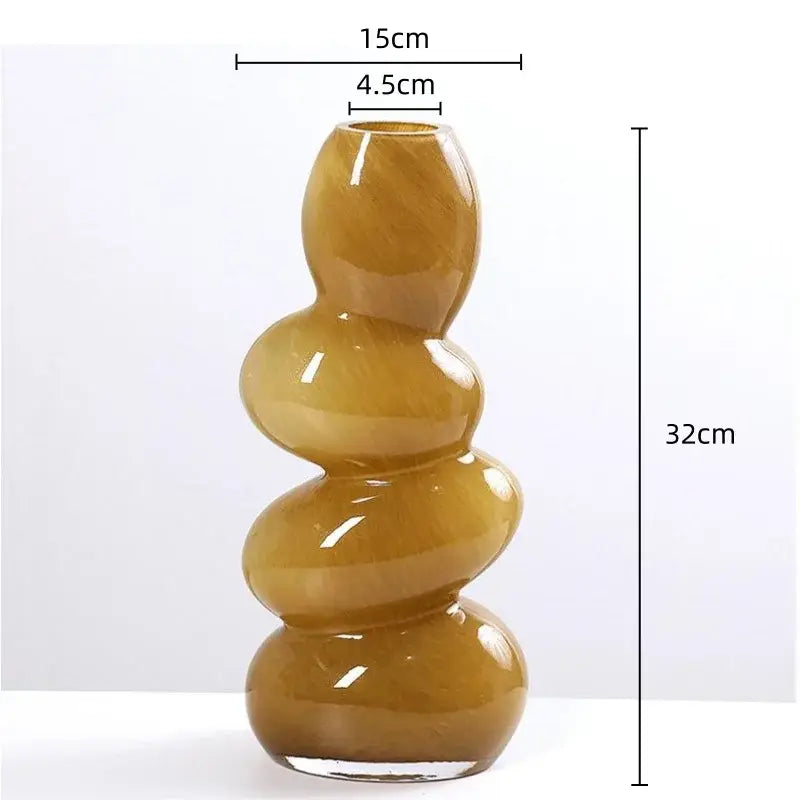 A tall amber glass stackable terrarium with stacked rounded segments and a glossy finish for home decor by decorbites geometric glass