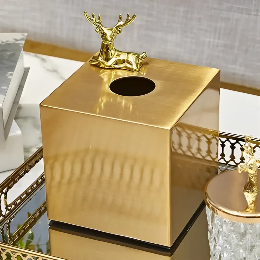 Gold-finished geometric animal tissue box with brass color featuring a small golden deer decorbites living room decor