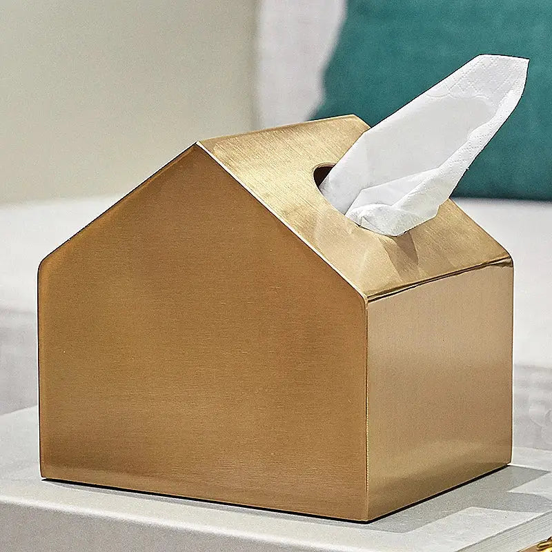 Gold-colored metallic tissue box shaped like a house with white paper towel for geometric animal decorbites brass color decor