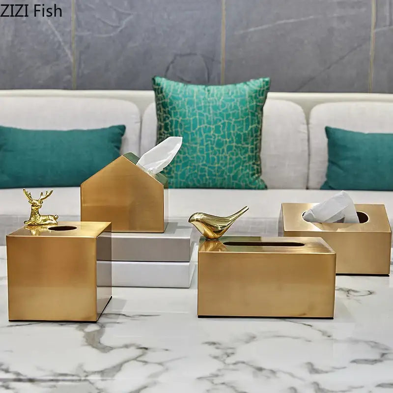 Gold-colored metallic tissue box holder with geometric animal figurines brass color decorbites living room decor