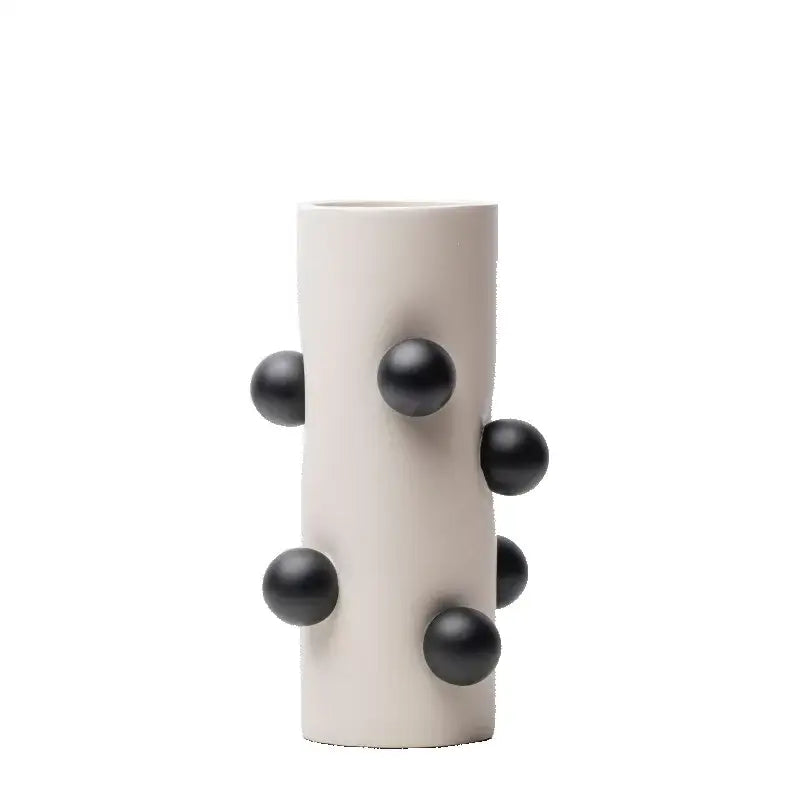 Cream-colored ceramic geometric ball vase with glossy black spherical protrusions for living room decorbites geometric ball