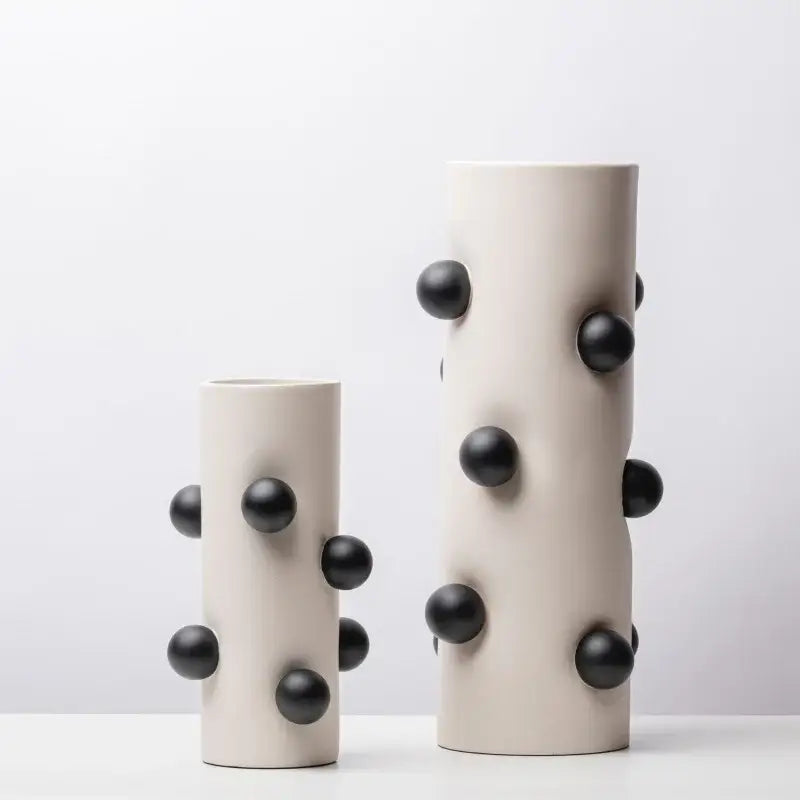 Cream-colored ceramic geometric ball vase with matte black spherical protrusions for living room decorbites geometric decor