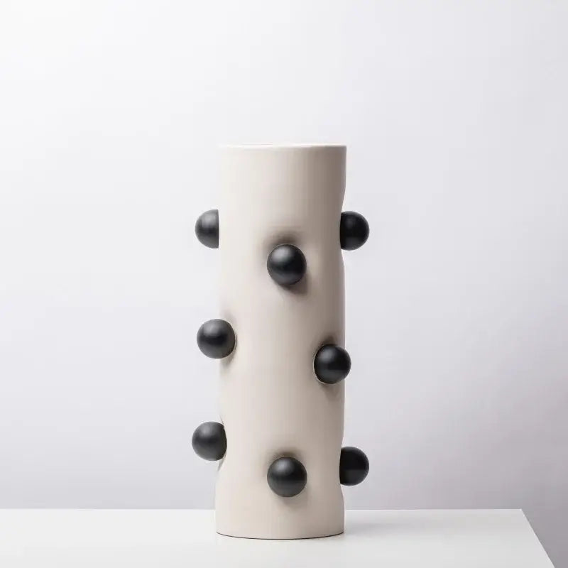 Cream-colored ceramic geometric ball vase with glossy black spherical protrusions for living room decorbites geometric decor