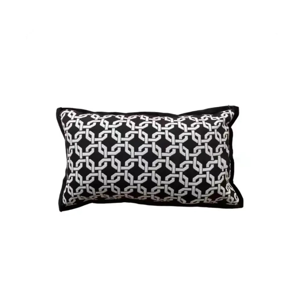 Black rectangular pillow cover with bold white geometric chain-link pattern in jacquard cover set for living room