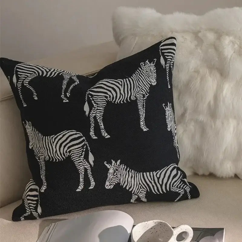 Geometric black and cream jacquard pillow cover set featuring a black pillow cover with white zebra silhouette pattern
