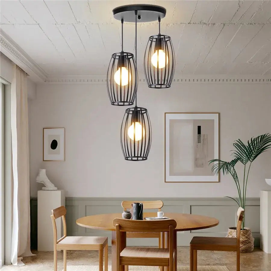Black wrought iron decorbites iron 3-light chandelier pendant with three cylindrical cages and warm glowing bulbs