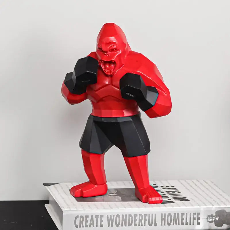 Geometric black and gold king kong gorilla sculpture with angular design red and black decorbites king kong desk decor
