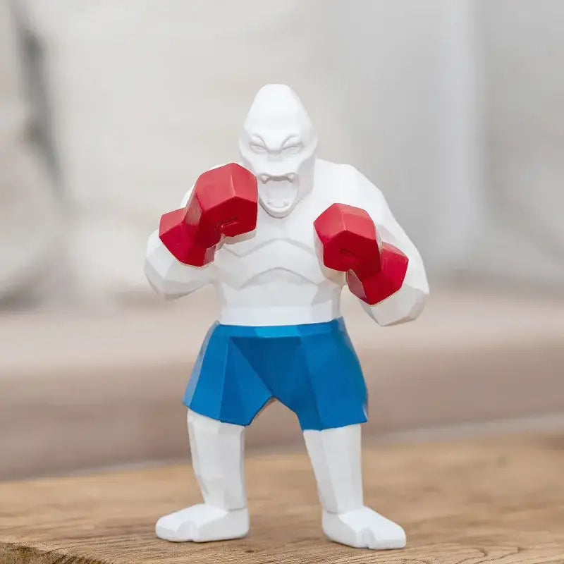 White geometric kong gorilla sculpture with red boxing gloves and blue shorts for decorbites king kong office decor