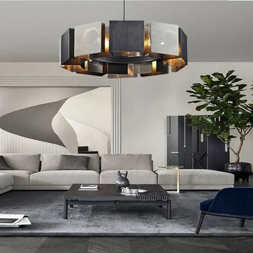 Modern geometric black metal pendant light with layered matte black and brushed gold panels for dining room decorbites