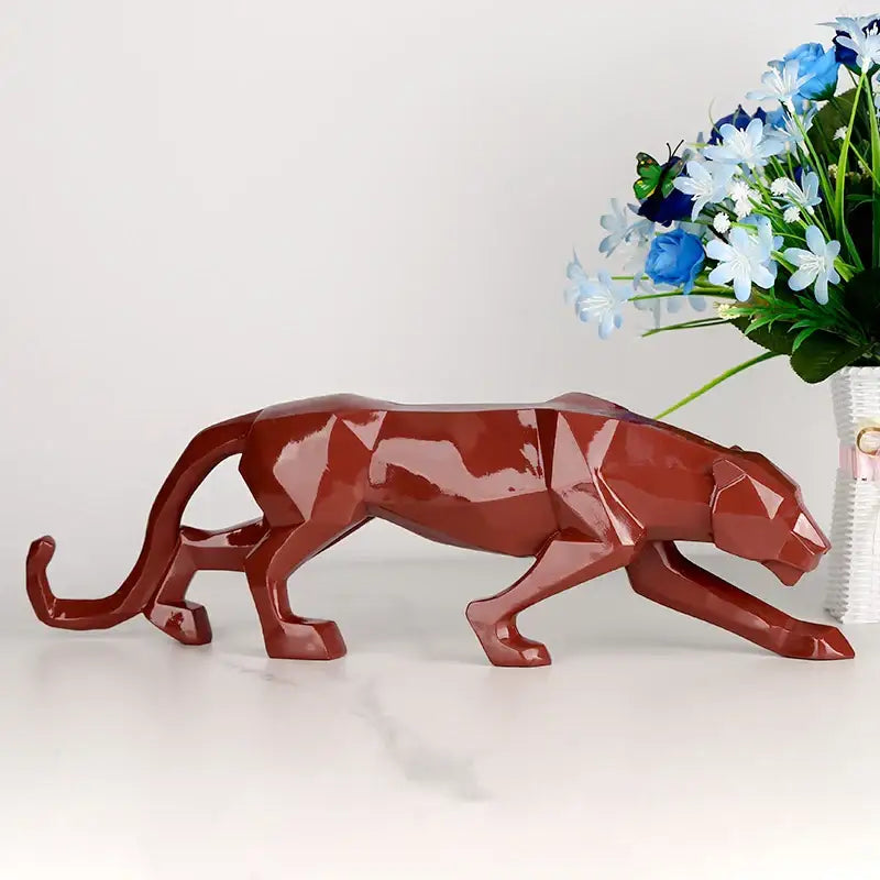 A sleek glossy terracotta panther resin geometric statue for living room decorbites black panther decor