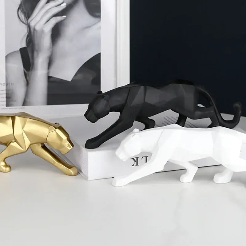 Three stylized gold black and white panther resin geometric statues for living room decor by decorbites black panther
