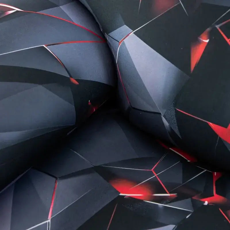 Geometric black and red stretch recliner cover with angular faceted fabric pattern for living room use