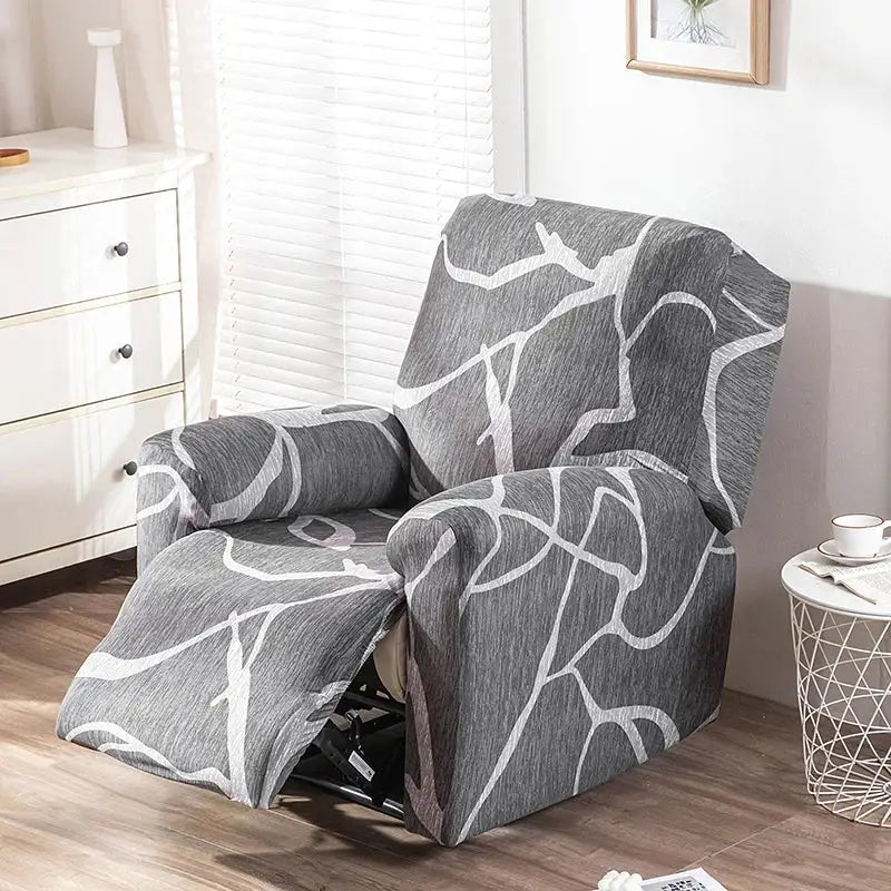 Gray and white abstract-patterned stretch fabric recliner cover shown with geometric black and red design for living room use