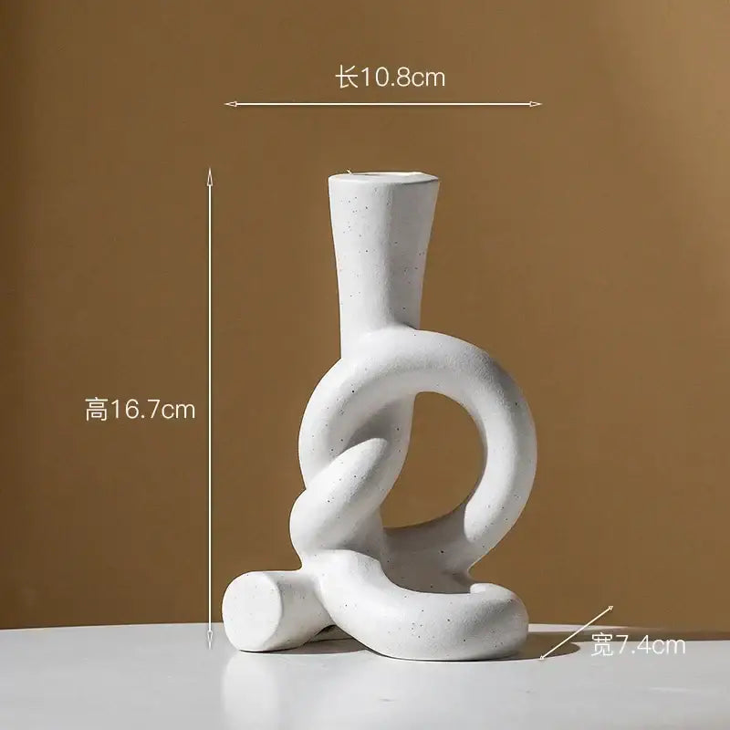 White ceramic candle stand with abstract black and white knot design for home decor by decorbites ceramic knot