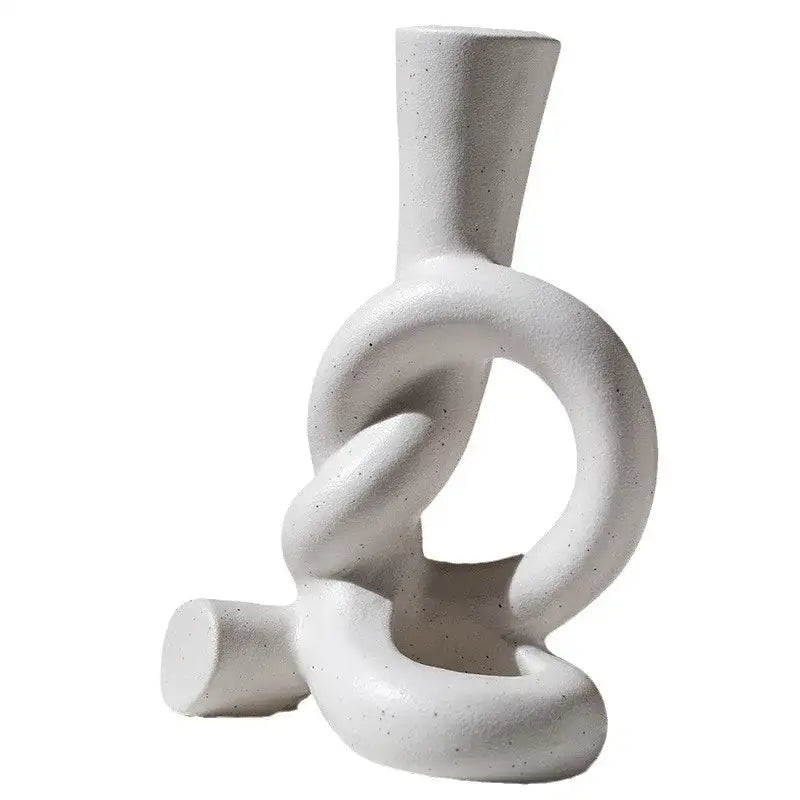 White ceramic candle stand with textured speckled finish and abstract knot design for home decor by decorbites ceramic knot