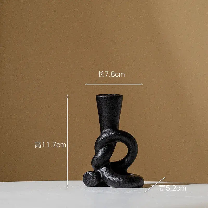 Black ceramic candle stand with twisted abstract design for home decor by decorbites ceramic knot collection