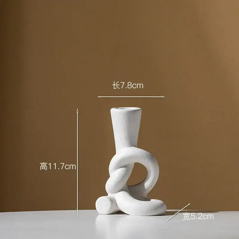 White ceramic candle stand with abstract black and white intertwined knot design for home decor by decorbites ceramic knot