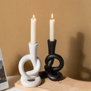 White and black ceramic knot candle stand with sculpted design for elegant home decor by decorbites ceramic knot