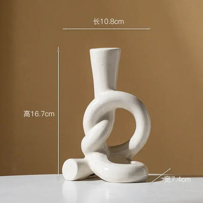 White ceramic candle stand with abstract black geometric knot design for home decor by decorbites ceramic knot
