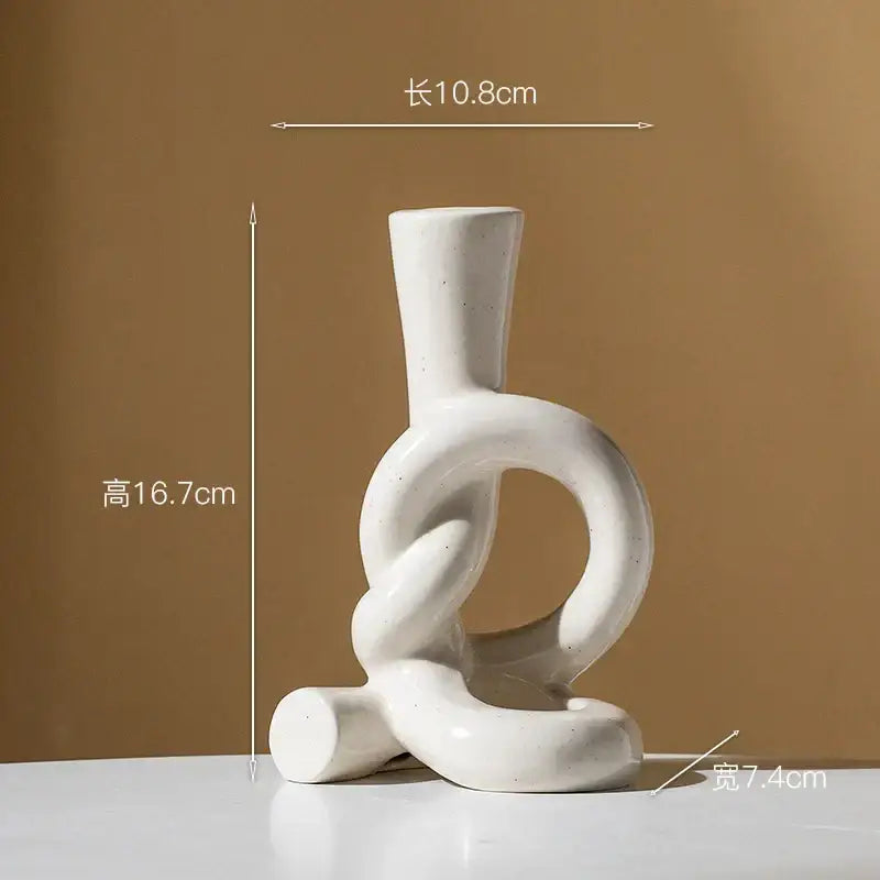 White ceramic candle stand with abstract black geometric knot design for home decor by decorbites ceramic knot