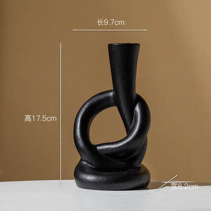 Black matte ceramic candle stand with abstract twisted ring design for home decor by decorbites ceramic knot