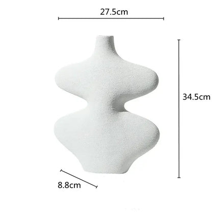 A sleek white geometric ceramic vase with textured surface from decorbites ceramic vase set for living room decor