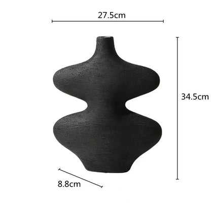 Black textured ceramic vase with asymmetrical geometric design featuring two rounded lobes in decorbites geometric ceramic set