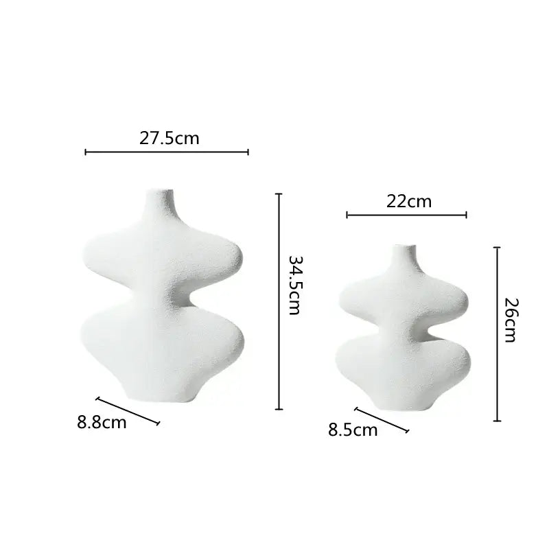 Two minimalist white ceramic vases with abstract sculptural forms in geometric ceramic vase set for living room decorbites decor