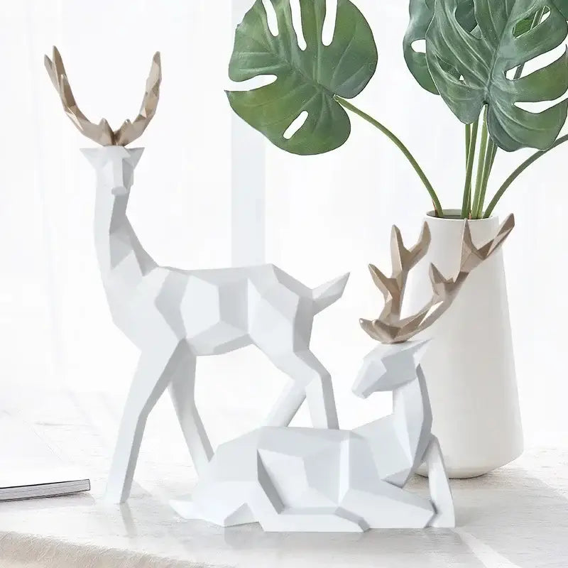 White geometric deer sculpture with gold-toned antlers by decorbites ideal for living room decor