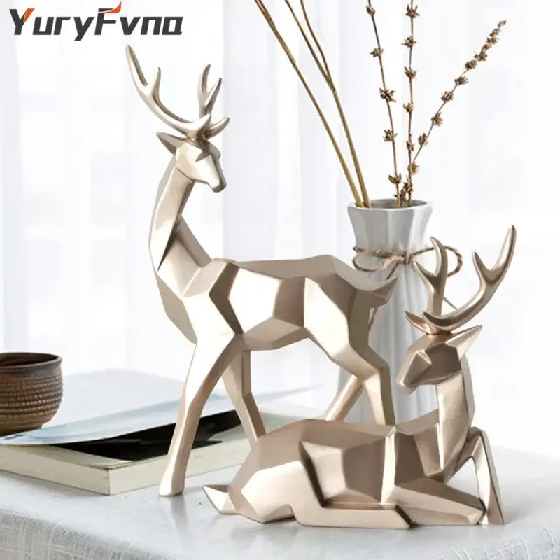 Gold-toned geometric deer sculpture with angular faceted surfaces and stylized antlers for living room decorbites deer sculpture