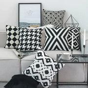 Black white embroidered cushion cover with geometric pattern on light gray sofa for decorbites living room decor