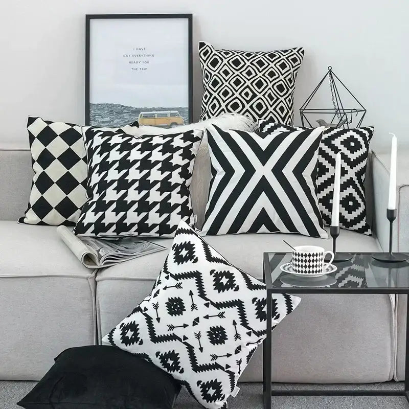 Black white embroidered cushion cover with geometric pattern on light gray sofa for decorbites living room decor