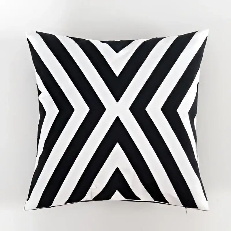 Geometric black and white embroidered cushion cover with bold diagonal stripes forming an x design for living room decorbites black white