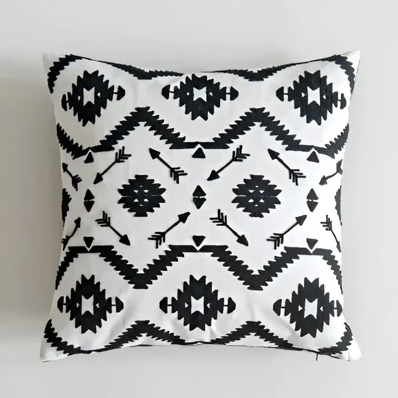 Black white embroidered cushion cover with tribal geometric pattern for living room decor by decorbites