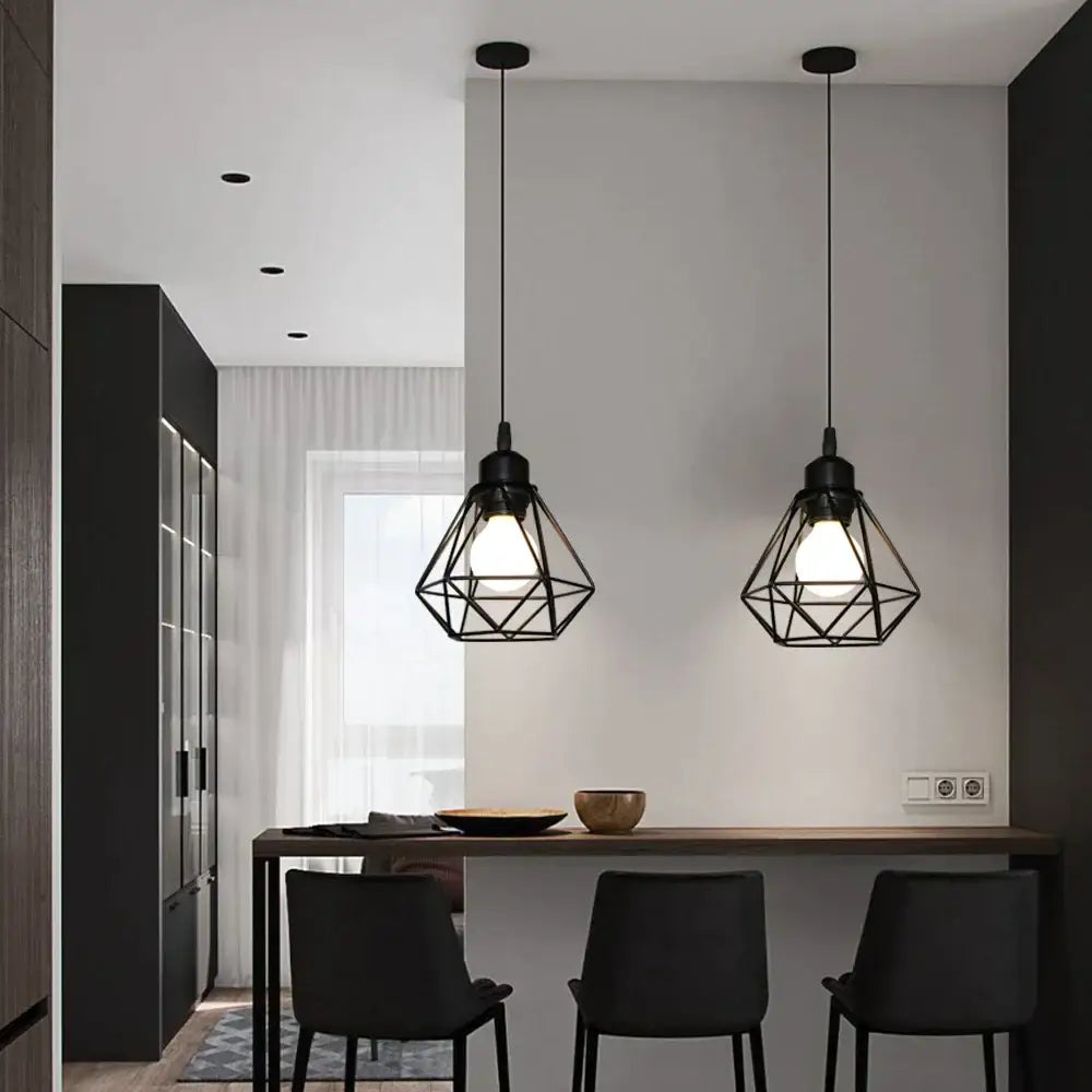 Geometric black iron frame pendant chandelier with cage-like decorbites iron frame hanging above dining table