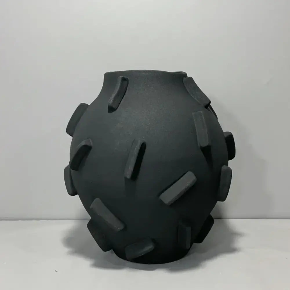 Black ceramic geometric block ceramic vase with rounded body and protruding rectangular ridges for living room decorbites decor