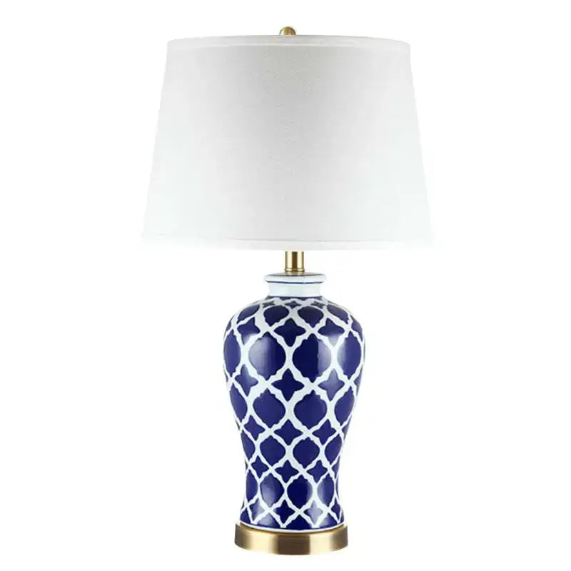 Geometric blue ceramic bedside table lamp with white patterns and gold base for bedroom use