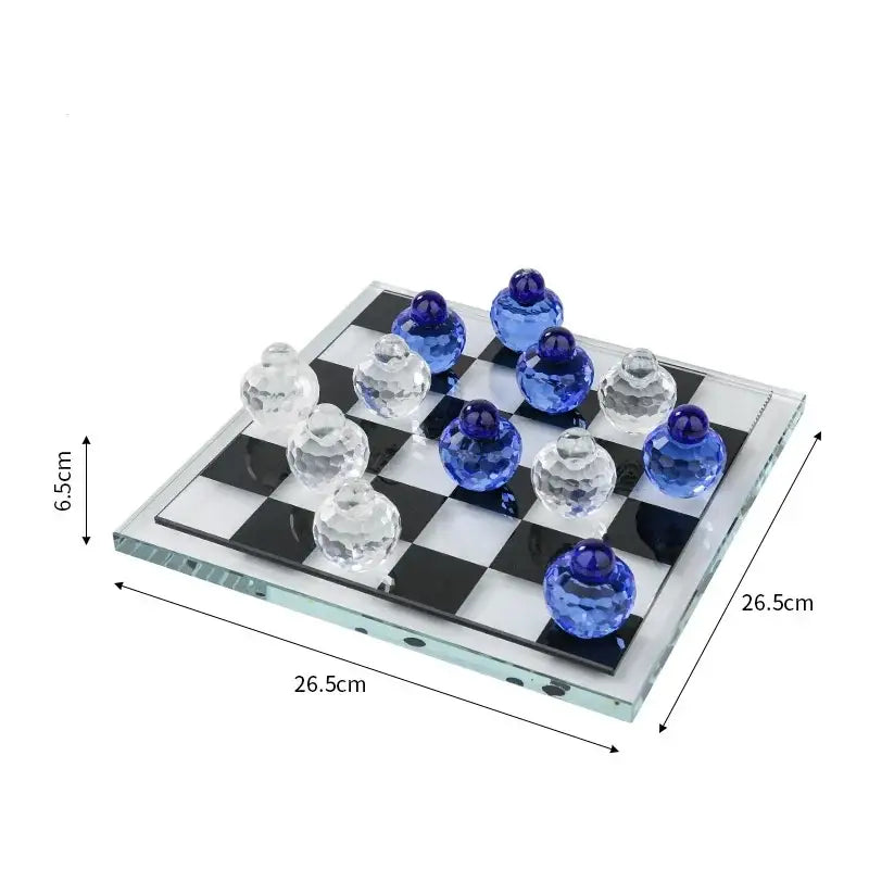 Geometric blue and clear glass chess set with crystal pieces and blue accents on a black and white checkered board