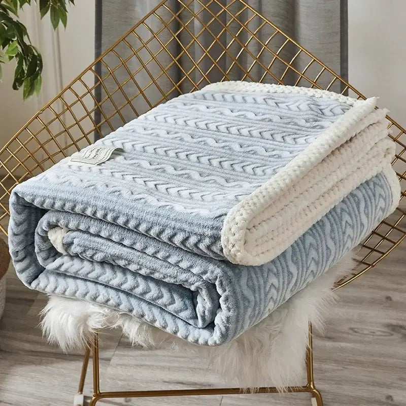 Light blue and cream two-toned plush decorbites coral fleece flannel blanket with textured chevron pattern for bedroom warmth