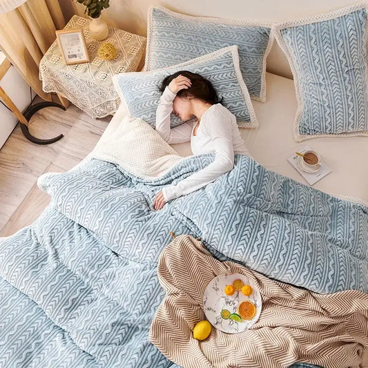 Soft blue coral fleece flannel blanket with geometric designs and cozy textured fabric for warm bedroom decorbites use